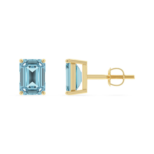 lab grown aquamarine emerald cut stud earrings in yellow gold