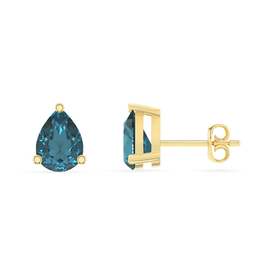 natural london blue topaz pear stud earrings in yellow gold