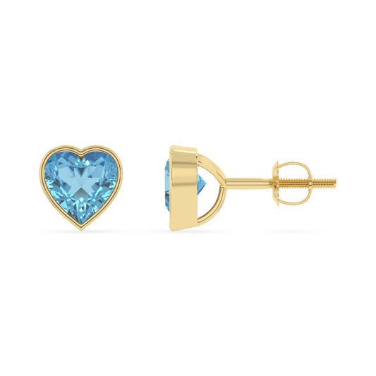 natural swiss blue topaz heart stud earrings in yellow gold