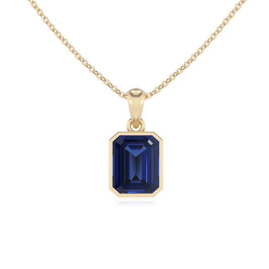 lab grown blue-sapphire emerald cut solitaire necklaces in yellow gold