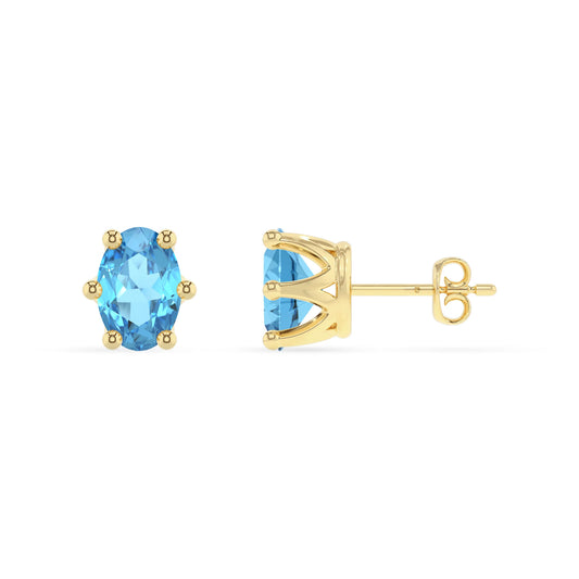 natural swiss blue topaz oval stud earrings in yellow gold