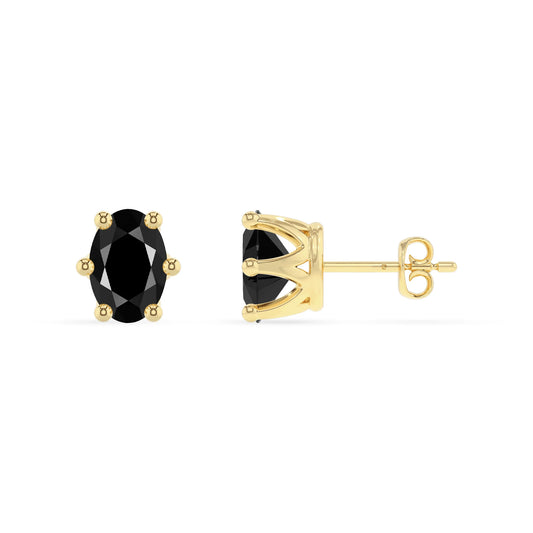 natural black onyx oval stud earrings in yellow gold