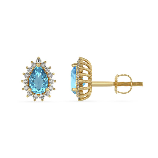 natural swiss blue topaz pear stud earrings in yellow gold