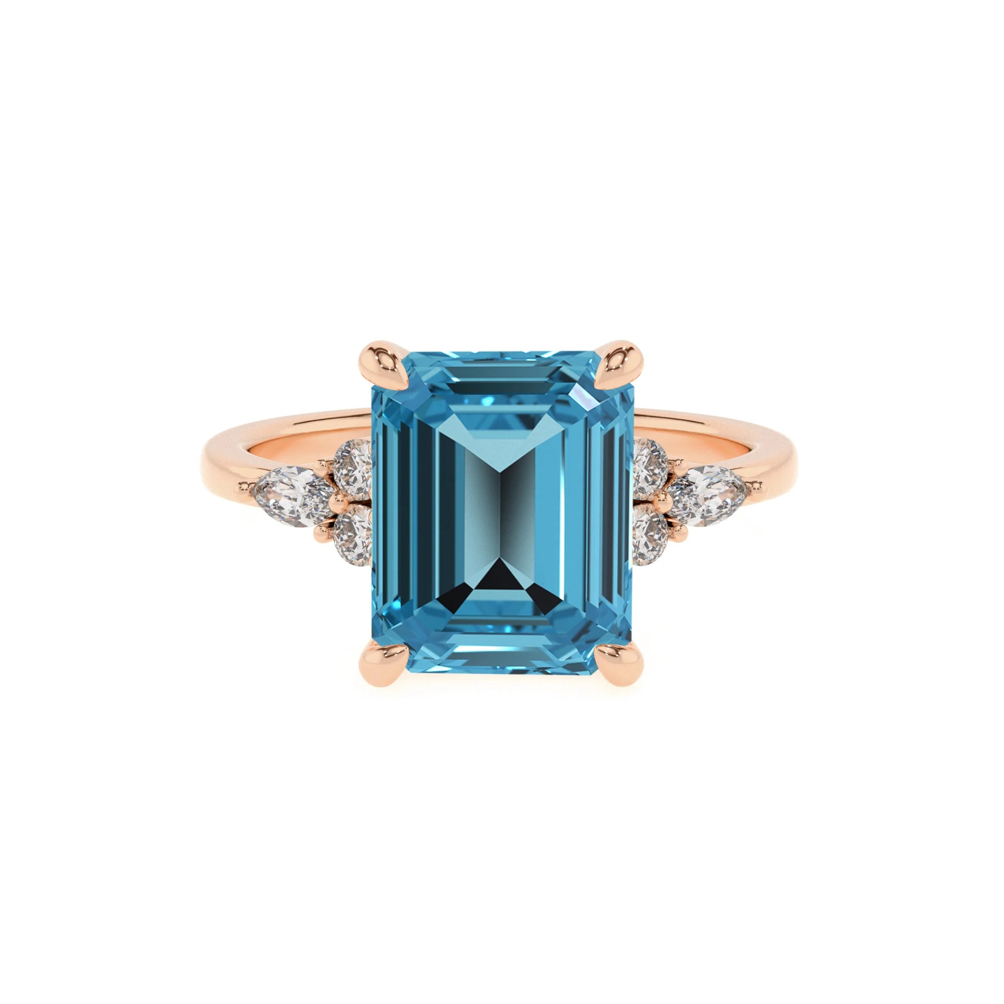 natural swiss-blue-topaz emerald cut solitaire rings in rose gold