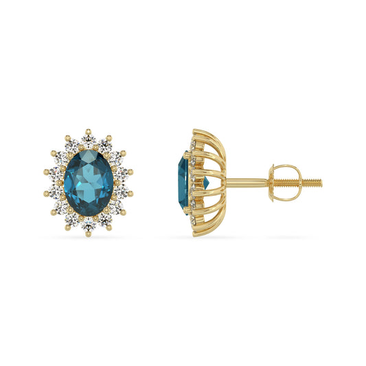 natural london blue topaz oval stud earrings in yellow gold