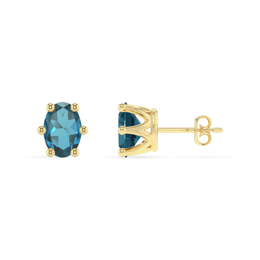 natural london blue topaz oval stud earrings in yellow gold