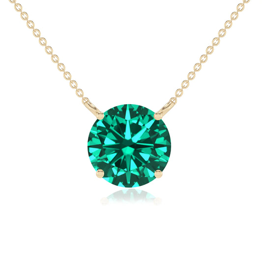 lab grown emerald round solitaire necklaces in yellow gold