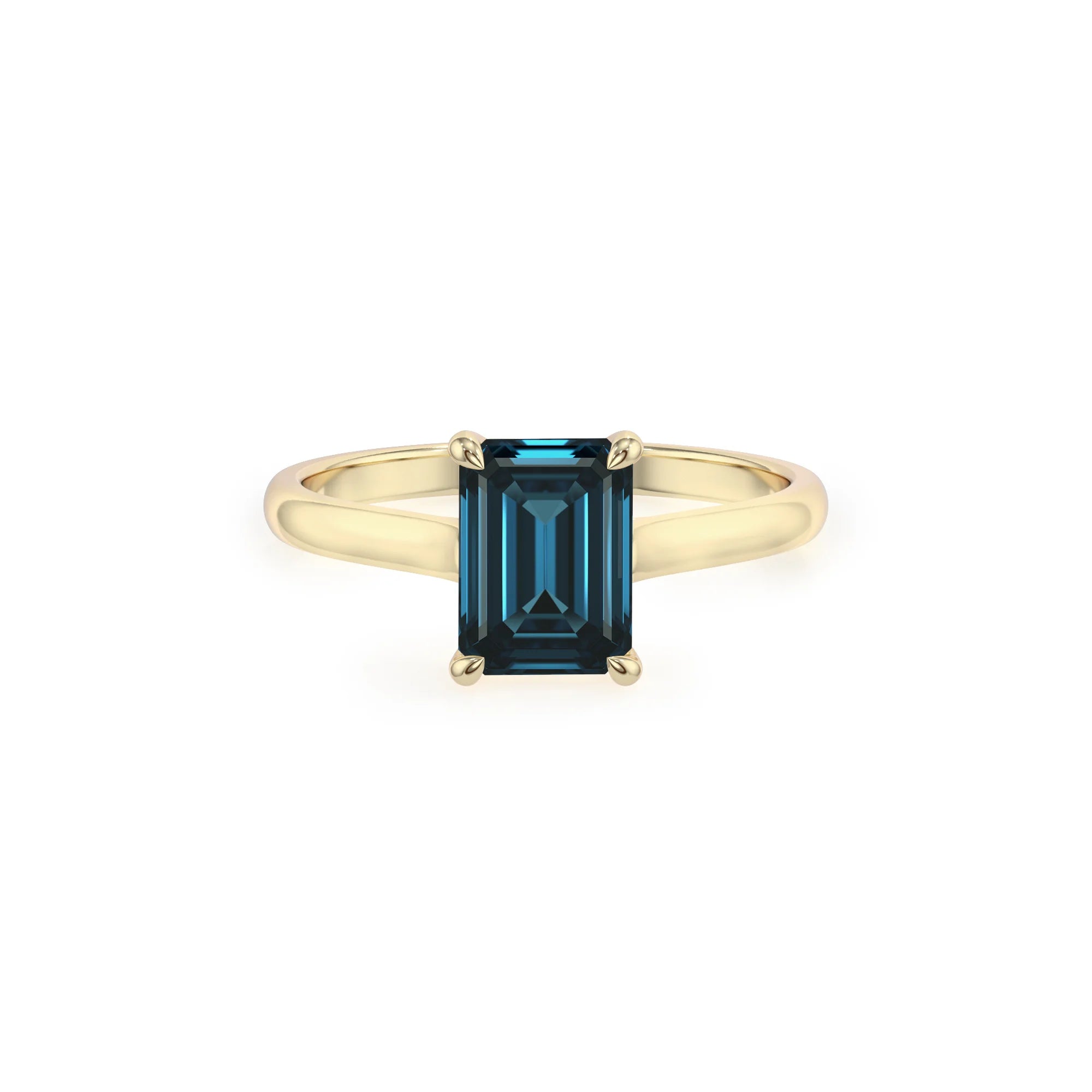 natural london-blue-topaz emerald cut solitaire rings in yellow gold