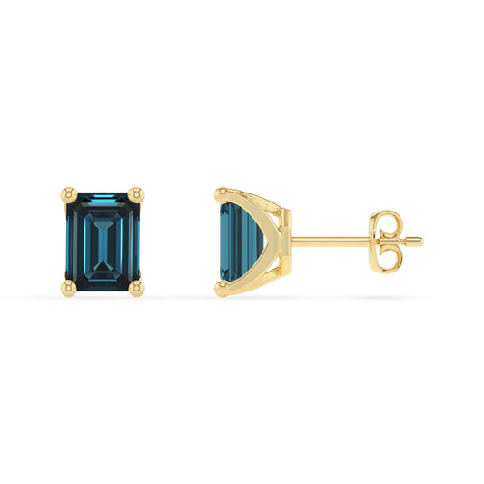 natural london blue topaz emerald cut stud earrings in yellow gold