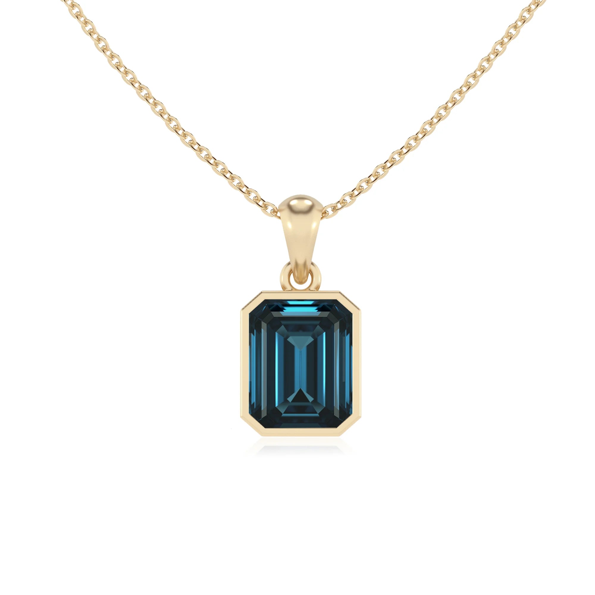 natural london-blue-topaz emerald cut solitaire necklaces in yellow gold