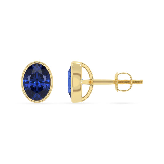 lab grown blue sapphire oval stud earrings in yellow gold