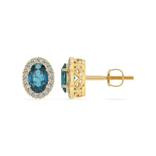 natural london blue topaz oval stud earrings in yellow gold