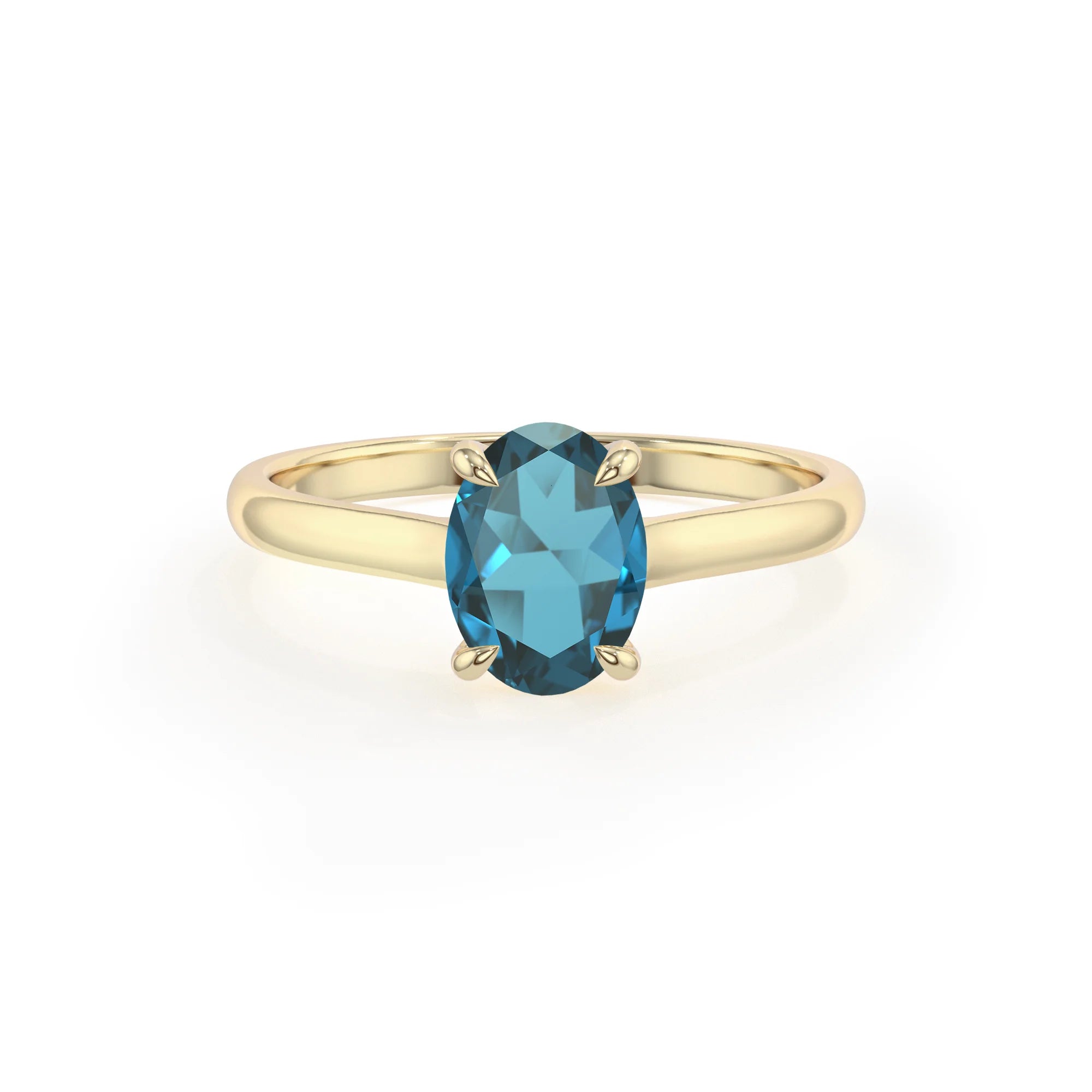 natural london-blue-topaz oval solitaire rings in yellow gold