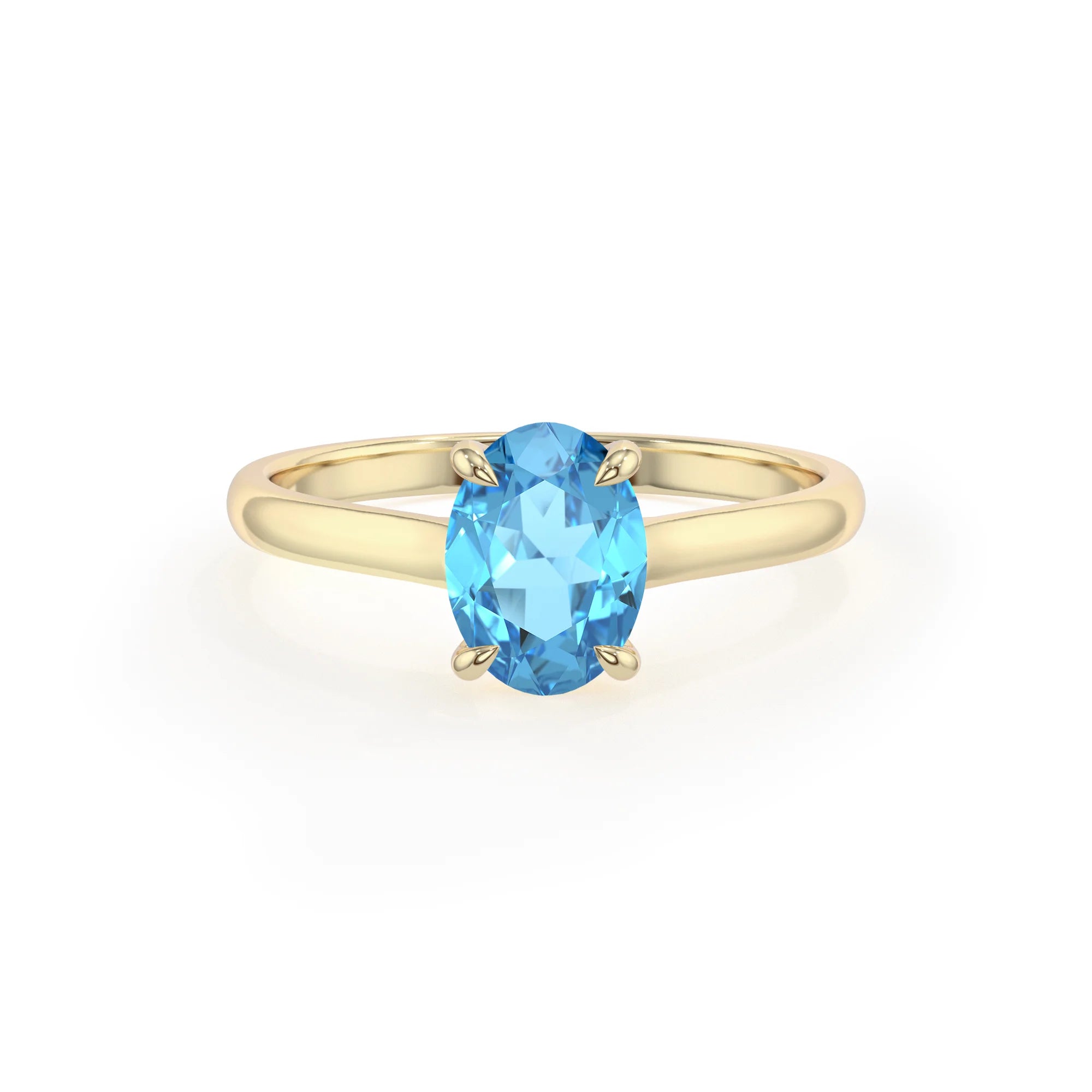 natural swiss-blue-topaz oval solitaire rings in yellow gold