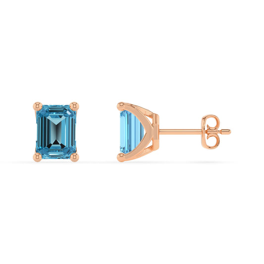 natural swiss blue topaz emerald cut stud earrings in rose gold