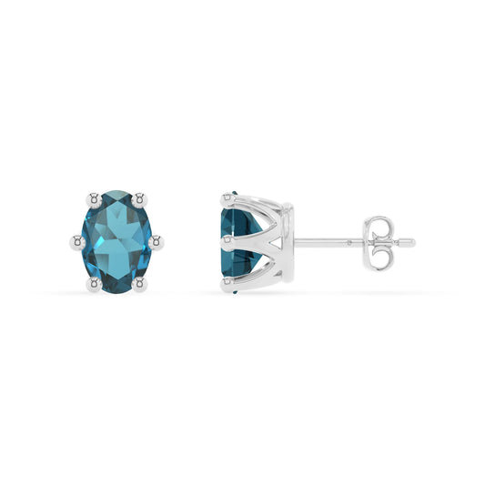 natural london blue topaz oval stud earrings in platinum