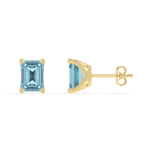 lab grown aquamarine emerald cut stud earrings in yellow gold