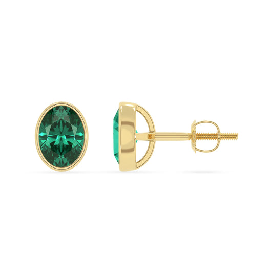 lab grown emerald oval stud earrings in yellow gold