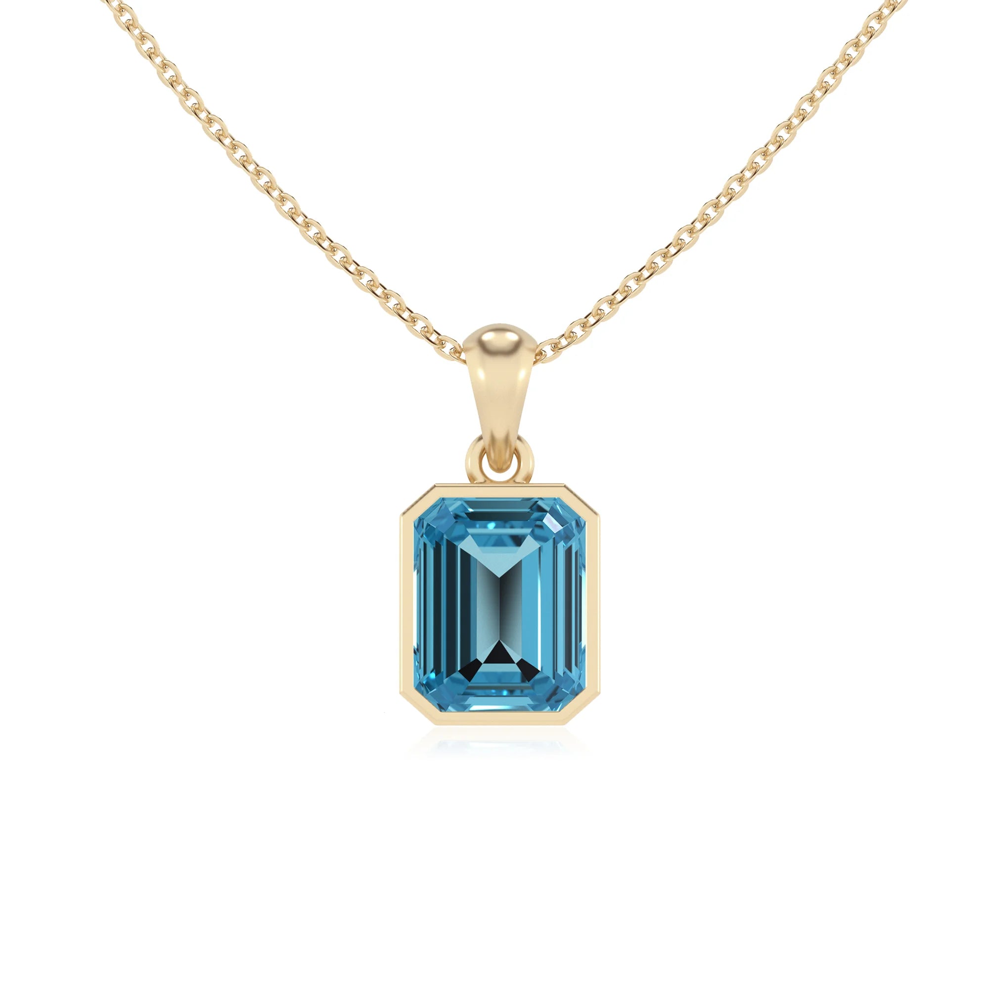 natural swiss-blue-topaz emerald cut solitaire necklaces in yellow gold
