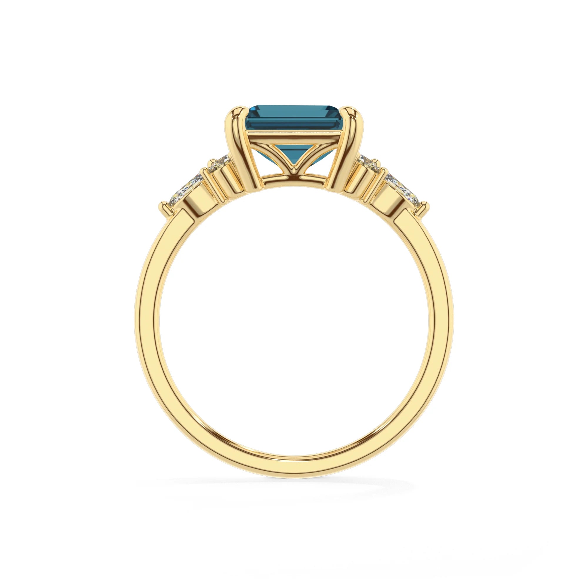 natural london-blue-topaz emerald cut solitaire rings in yellow gold