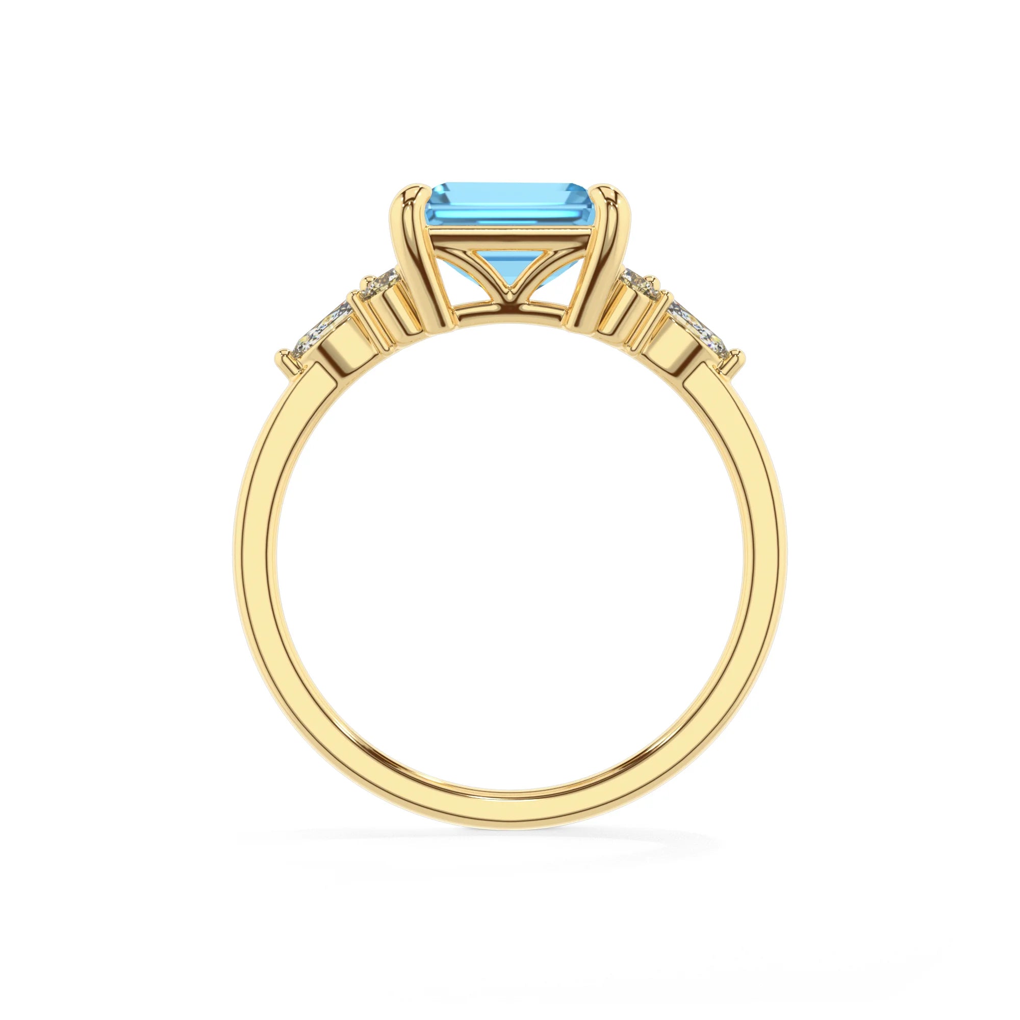 natural swiss-blue-topaz emerald cut solitaire rings in yellow gold