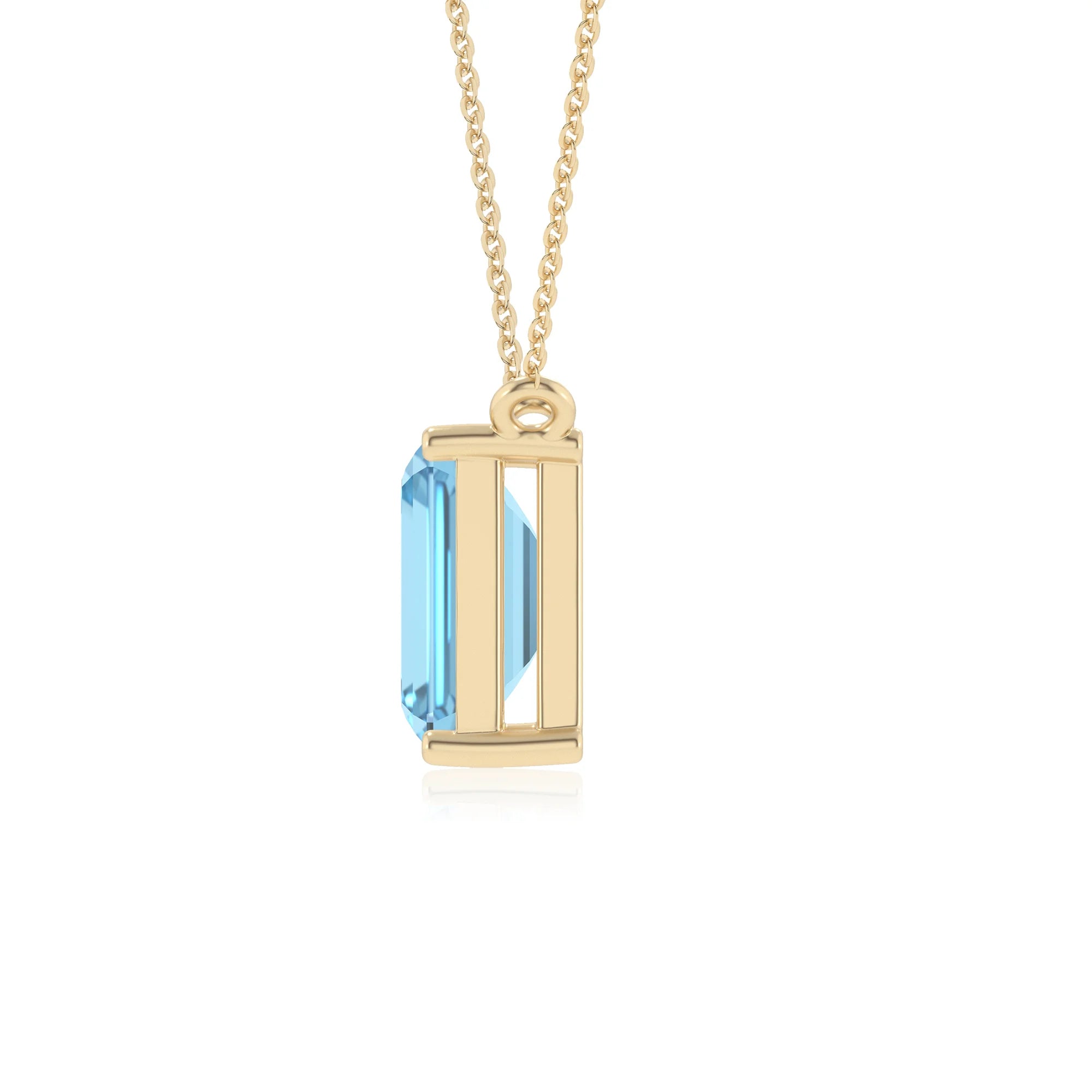 natural swiss-blue-topaz emerald cut solitaire necklaces in yellow gold