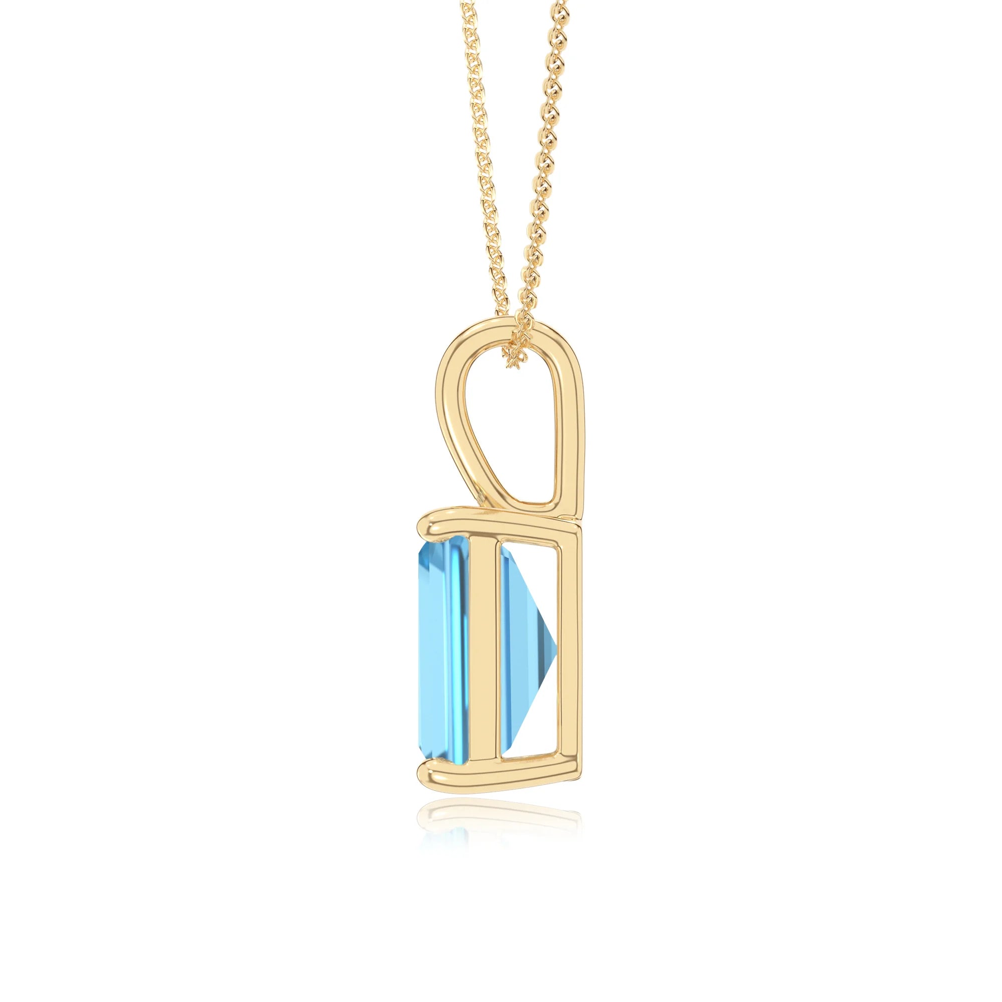 natural swiss-blue-topaz emerald cut solitaire necklaces in yellow gold