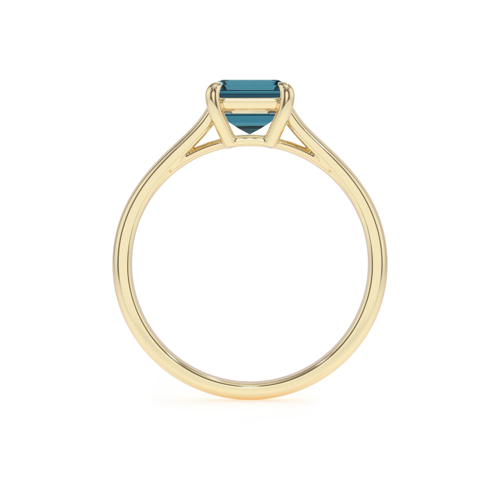 natural london-blue-topaz emerald cut solitaire rings in yellow gold