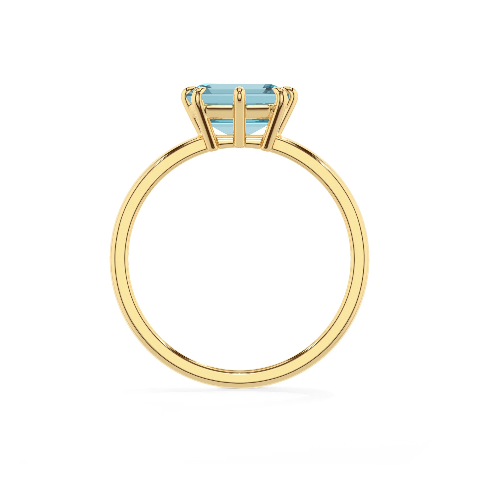 lab grown aquamarine emerald cut solitaire rings in yellow gold