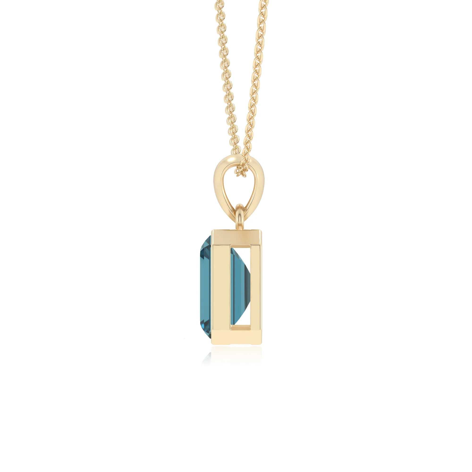natural london-blue-topaz emerald cut solitaire necklaces in yellow gold