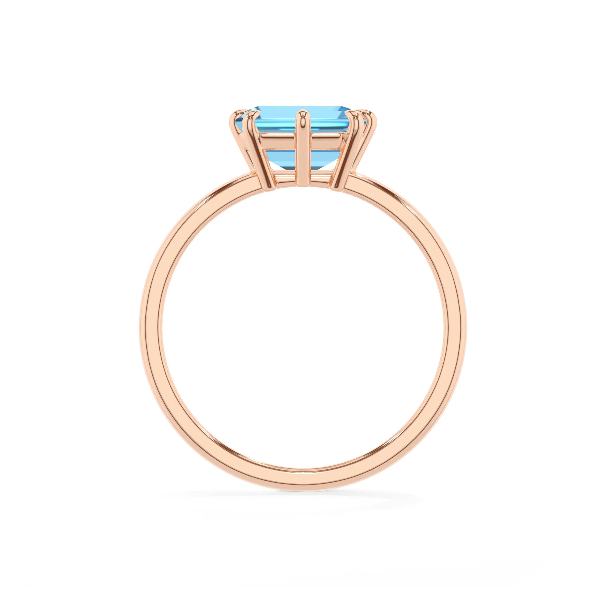 natural swiss-blue-topaz emerald cut solitaire rings in rose gold
