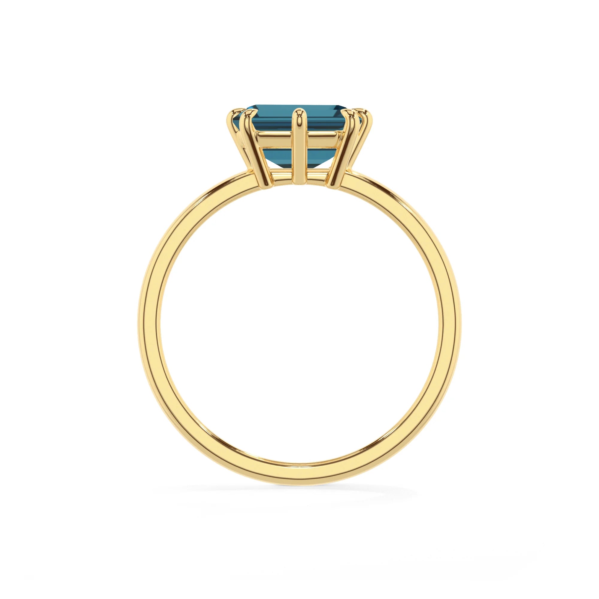 natural london-blue-topaz emerald cut solitaire rings in yellow gold