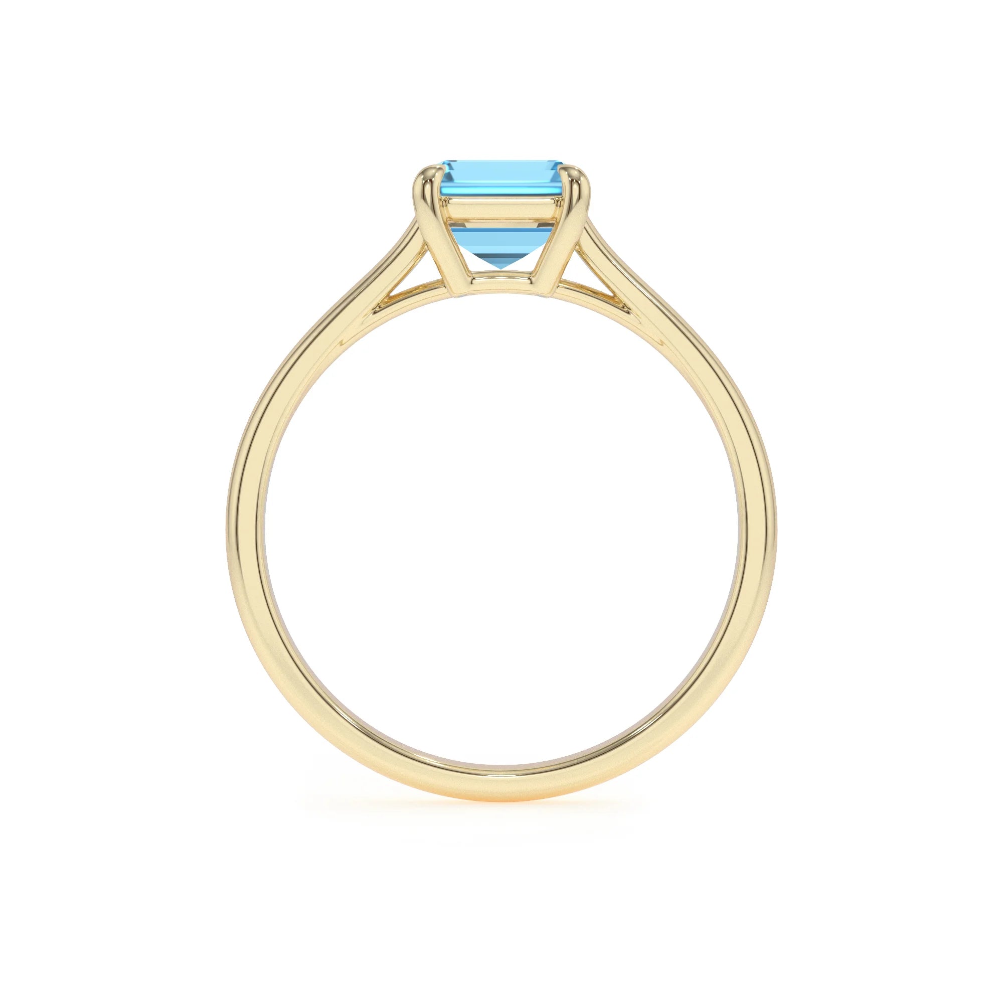 natural swiss-blue-topaz emerald cut solitaire rings in yellow gold