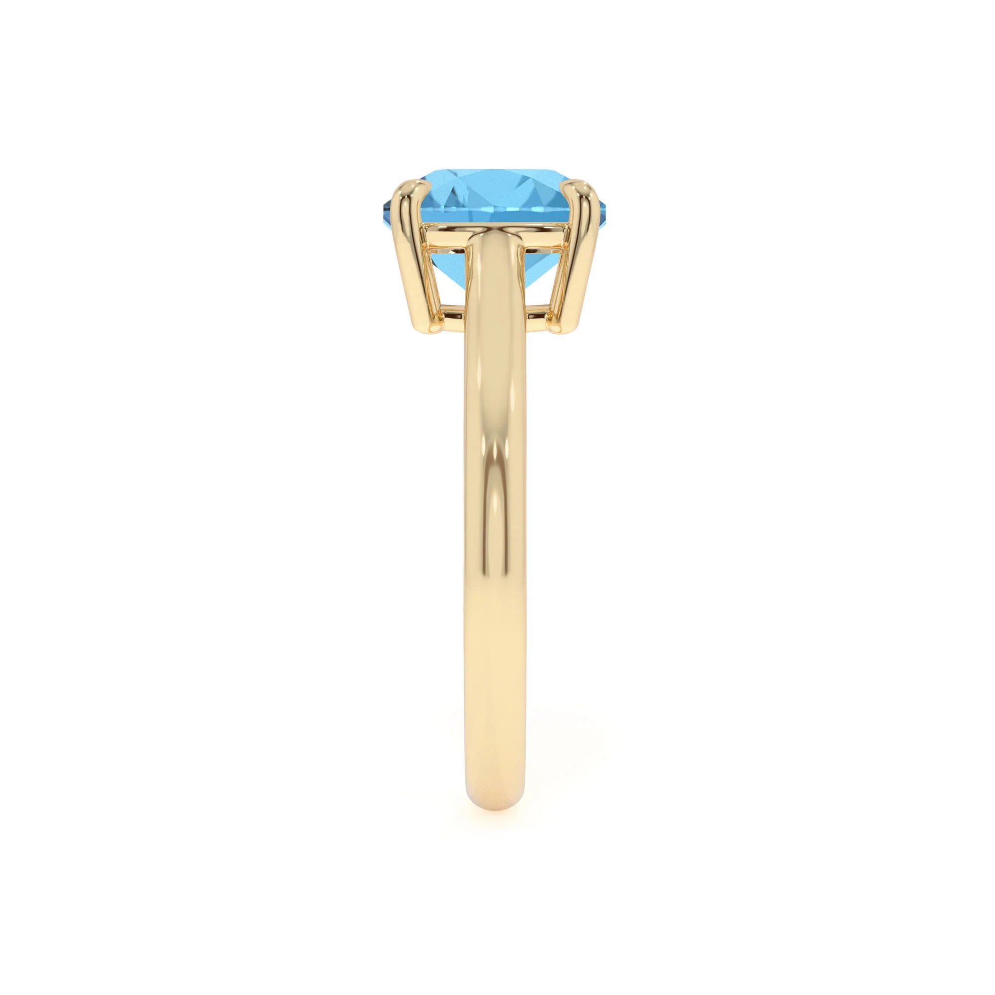 natural swiss-blue-topaz cushion solitaire rings in yellow gold