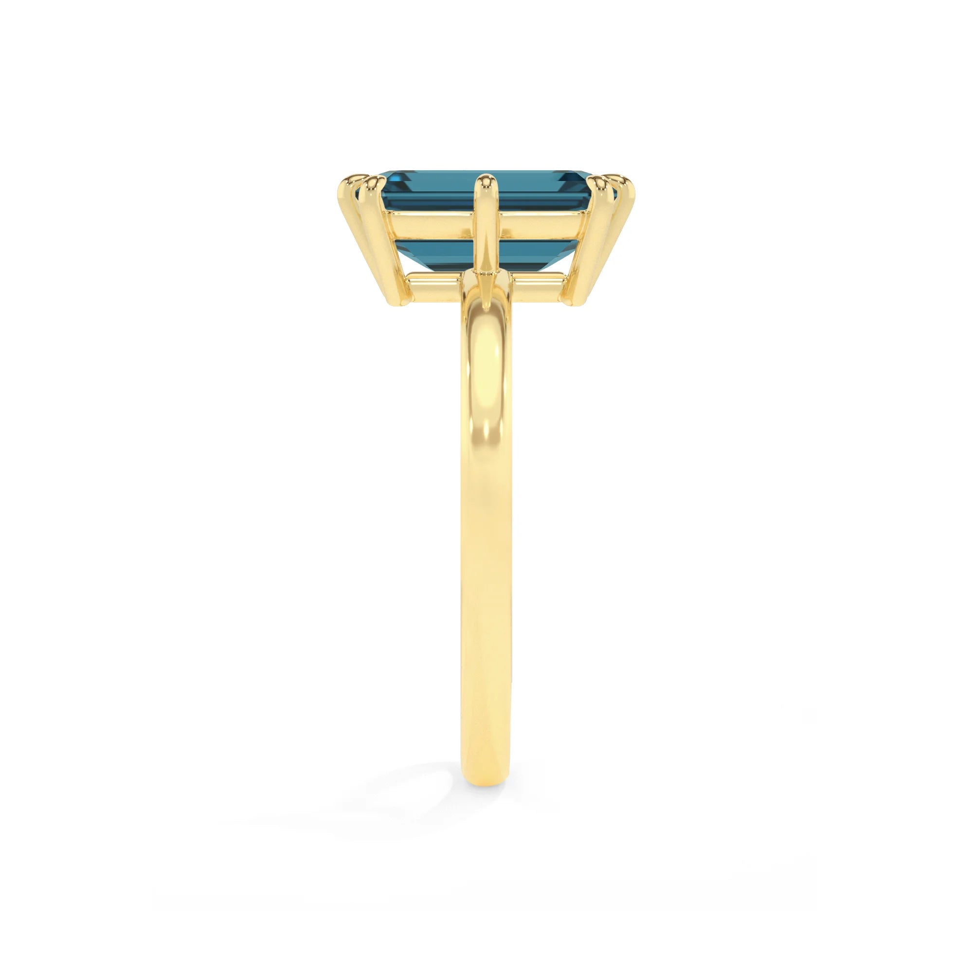 natural london-blue-topaz emerald cut solitaire rings in yellow gold