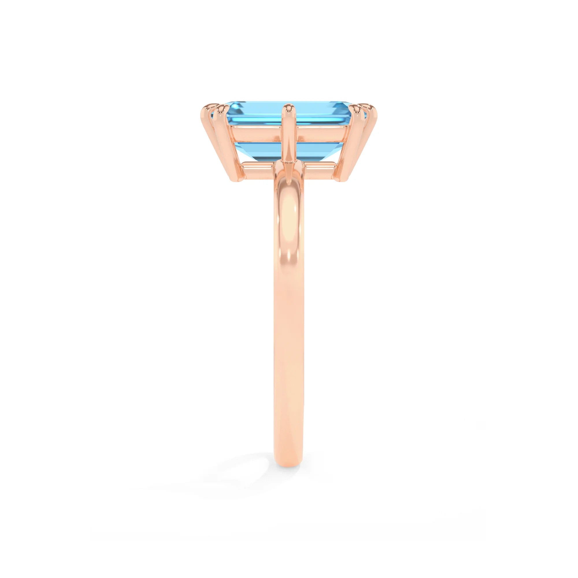 natural swiss-blue-topaz emerald cut solitaire rings in rose gold