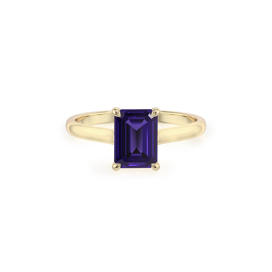 lab grown tanzanite emerald cut solitaire rings in yellow gold 