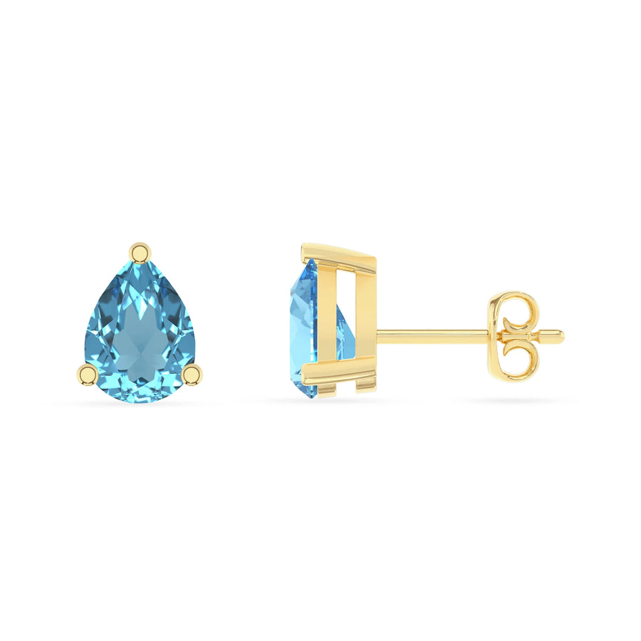 natural swiss blue topaz pear stud earrings in yellow gold 