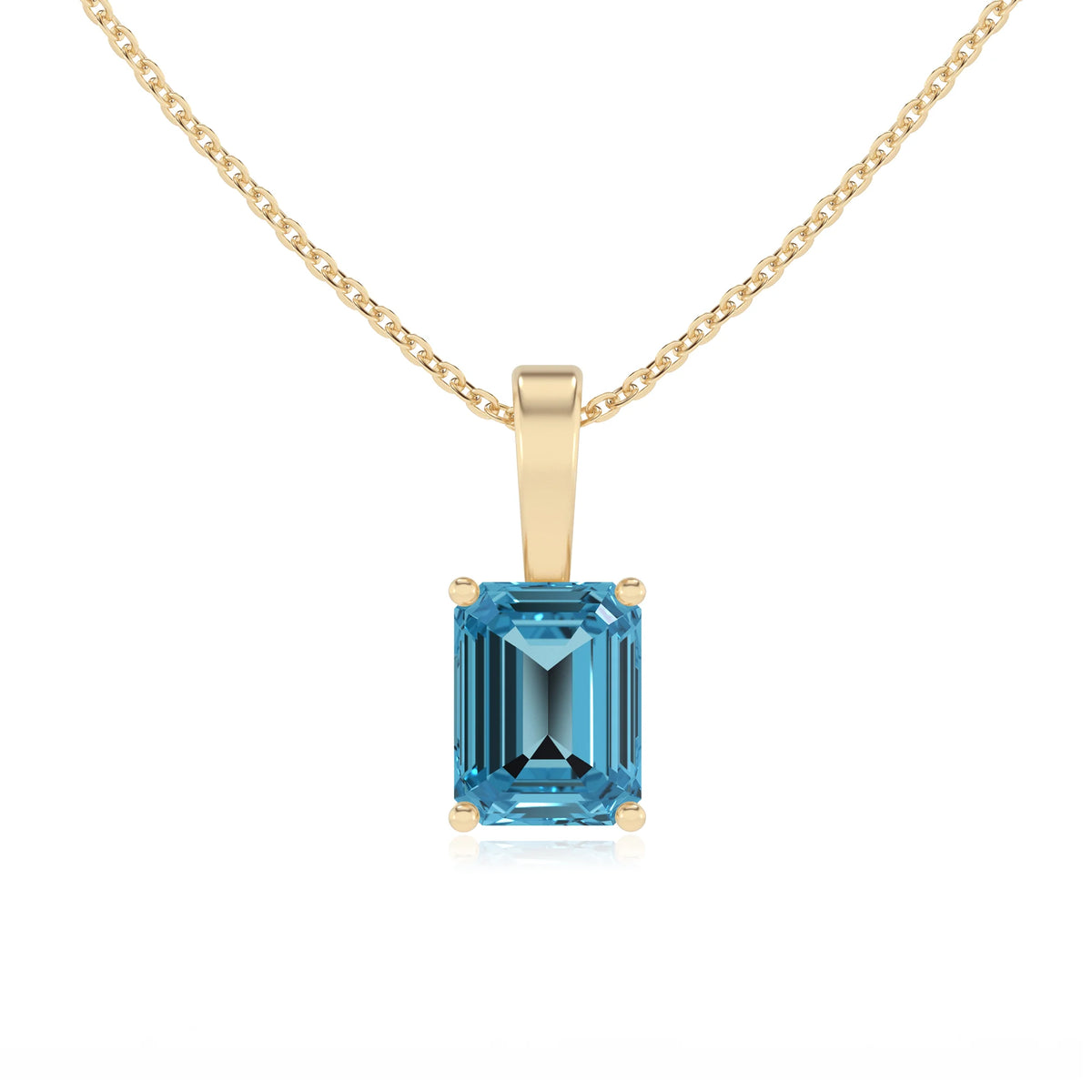 natural swiss-blue-topaz emerald cut solitaire necklaces in yellow gold 