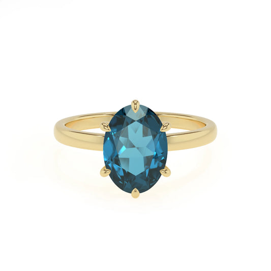 natural london-blue-topaz oval solitaire rings in yellow gold 