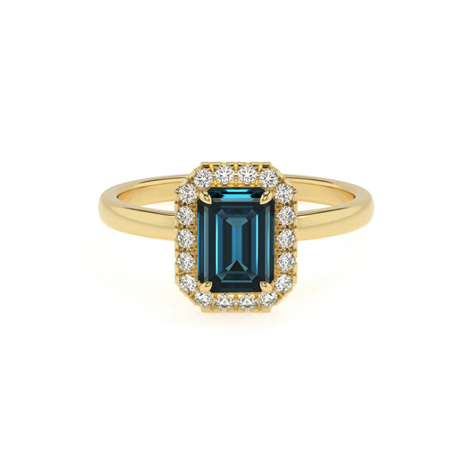 natural london-blue-topaz emerald cut solitaire rings in yellow gold 