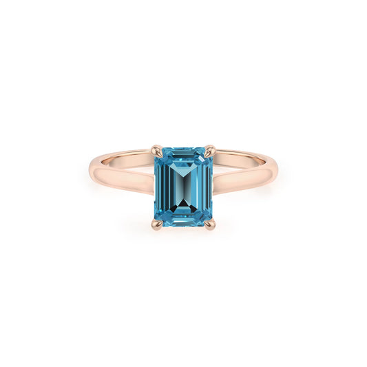 natural swiss-blue-topaz emerald cut solitaire rings in rose gold 