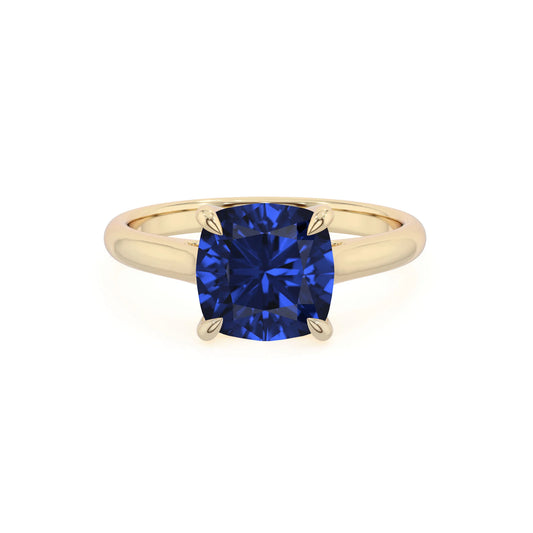lab grown blue-sapphire cushion solitaire rings in yellow gold 