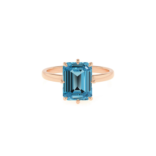 natural swiss-blue-topaz emerald cut solitaire rings in rose gold 