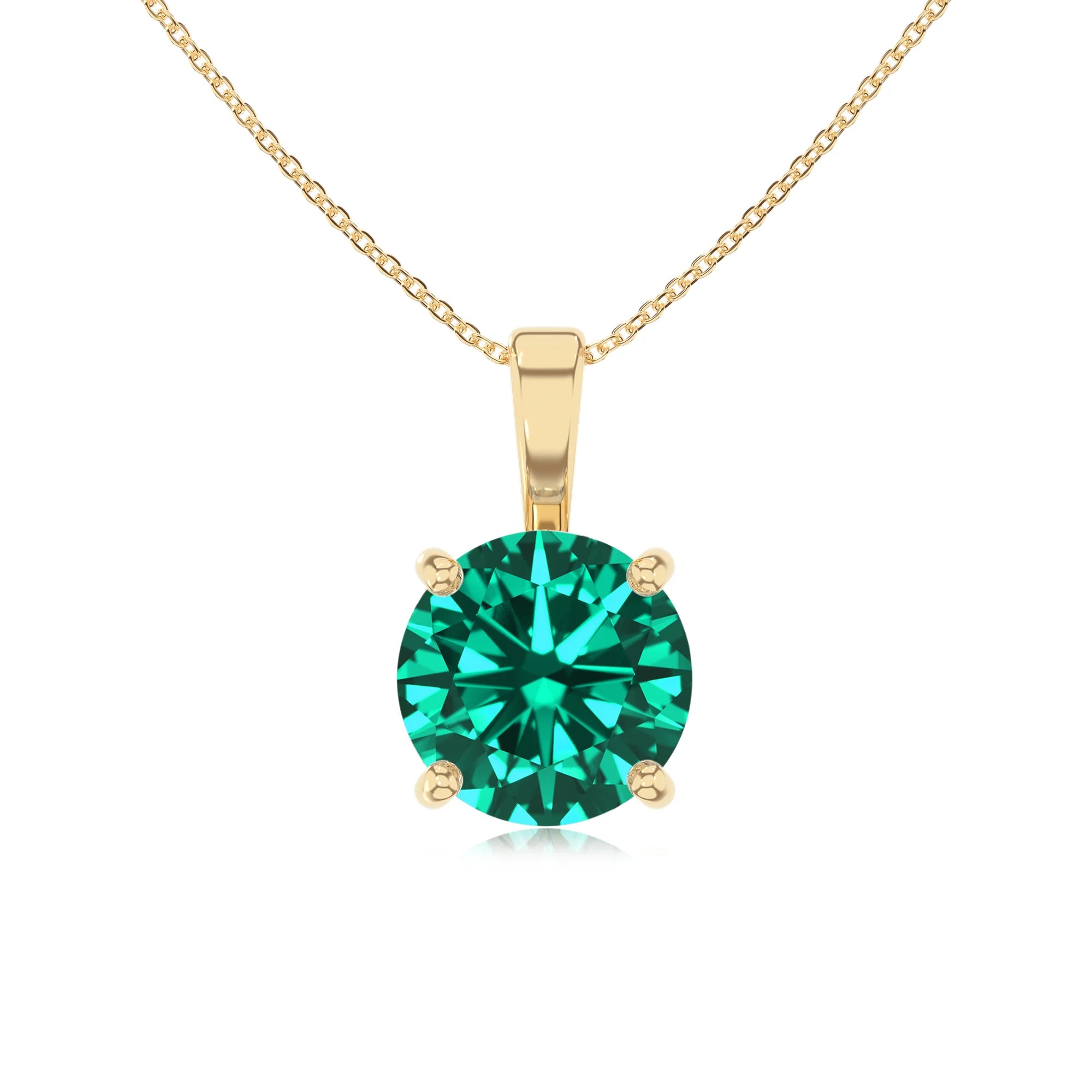lab grown emerald round solitaire necklaces in yellow gold 