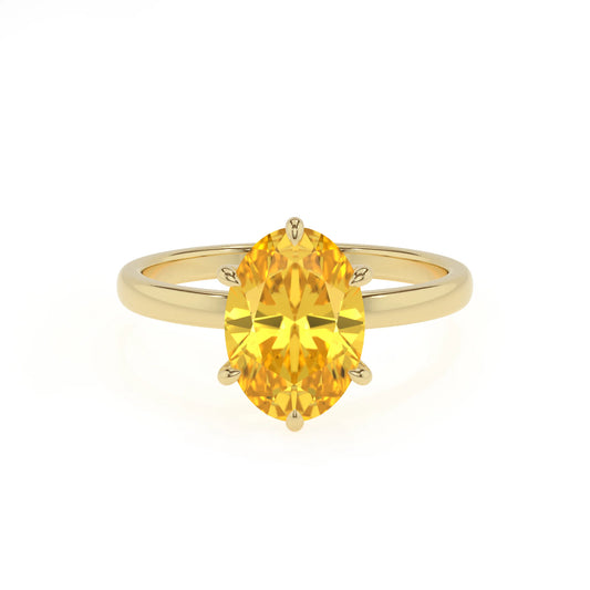 lab grown yellow-sapphire oval solitaire rings in yellow gold 
