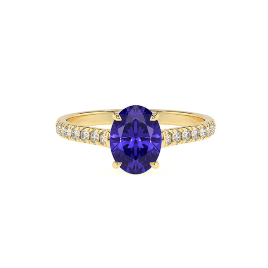 lab grown tanzanite oval half eternity solitaire engagement rings in yellow gold 