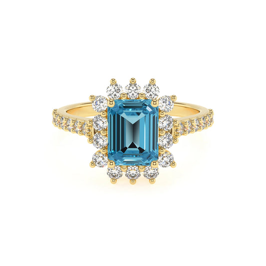 natural swiss-blue-topaz emerald cut solitaire rings in yellow gold 