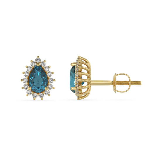 natural london blue topaz pear stud earrings in yellow gold 