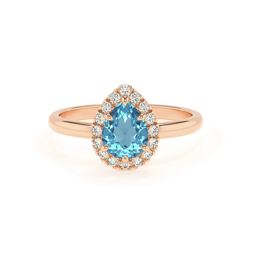 natural swiss-blue-topaz pear solitaire rings in rose gold 